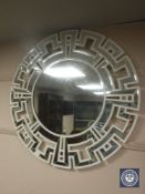 An all glass shaped bevelled circular mirror,