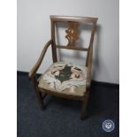 An antique oak armchair