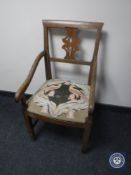 An antique oak armchair