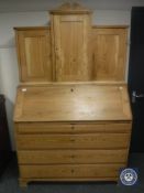 A continental antique pine bureau cabinet,