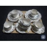 A tray containing eighteen pieces of Women's Institute tea china