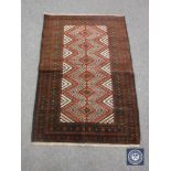 An old baluchi rug 128 cm x 88 cm