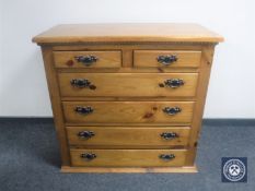 A pine six drawer chest with metal drop handles