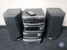 A Kenwood four-piece stack hifi system with speakers