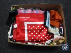 A box containing silk scarves