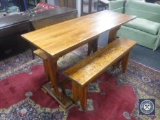 A pine refectory kitchen table together with two benches