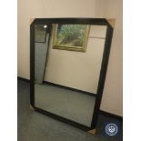 A black framed mirror,