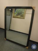 A black framed mirror,