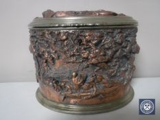 An early 20th century plated and copper embossed caddy with liner