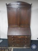A George III oak bureau bookcase