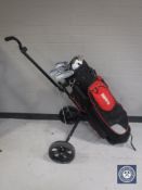 A Hippo golf bag together with a folding golf trolley,