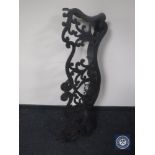 An antique cast iron fire curb