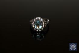 A blue topaz cluster ring set with diamonds, size M.