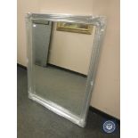 A traditional style mirror in a silvered framed,