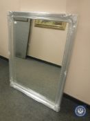 A traditional style mirror in a silvered framed,