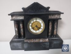 A Victorian black slate mantel lock with pillar supports,