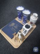 A tray containing Beswick figure of a terrier, Beswick deer, Herald stamp album,