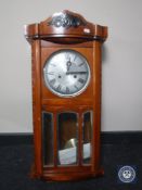 A 20th century 15 day wall clock with silvered dial