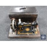 A vintage cased Jones hand sewing machine