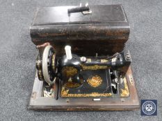 A vintage cased Jones hand sewing machine