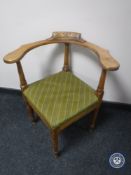A twentieth century oak corner chair