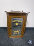 An early 20th century mirror door corner cabinet bearing Cherry Blossom Boot Polish advertising