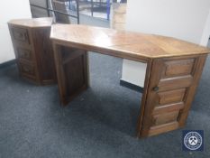 A reclaimed pine kneehole desk fitted two cupboards,