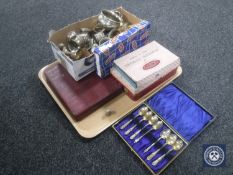A tray containing cased sets of cutlery together with a box containing a quantity of assorted