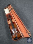 An early 20th century violin and two bows in case CONDITION REPORT: 14" back.