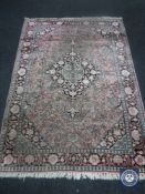 A Persian design rug,
