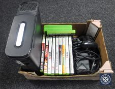 An Xbox 360 with leads,