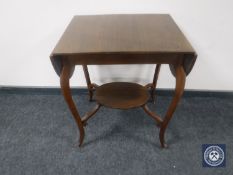 A 20th century oak flap sided table on cabriole legs