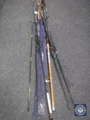 A two piece House of Hardy fishing rod in bag and four further fishing rods