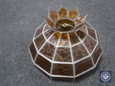 An amber glass leaded light shade