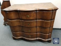 A 19th century continental oak serpentine front chest of four drawers,