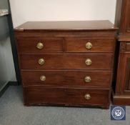 An early 19th century mahogany five drawer chest,