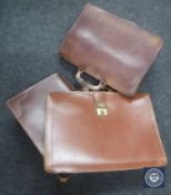 Four vintage brown leather briefcases