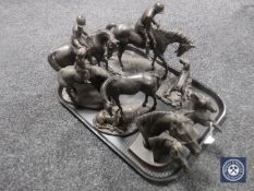 A tray of contemporary horse figures