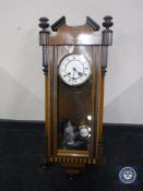 A mahogany cased Vienna wall clock