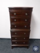 A reproduction inlaid mahogany six drawer chest