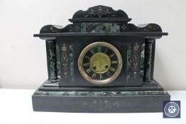 A Victorian slate mantel clock with painted brass dial