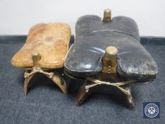 Two camel stools with leather seats