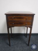 A Regency style two drawer side table