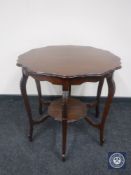 An early 20th century shaped mahogany occasional table