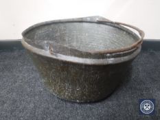 An antique copper cooking pot