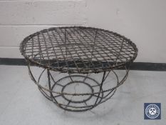 A circular wire patio table