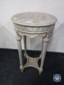 A reproduction French style circular occasional table