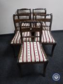 A set of five Victorian dining chairs upholstered in Regency style striped fabric