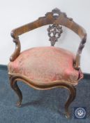 A Victorian mahogany armchair on cabriole legs
