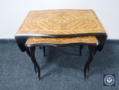 A nest of two ebonised and Kingwood veneered tables with gilt metal mounts